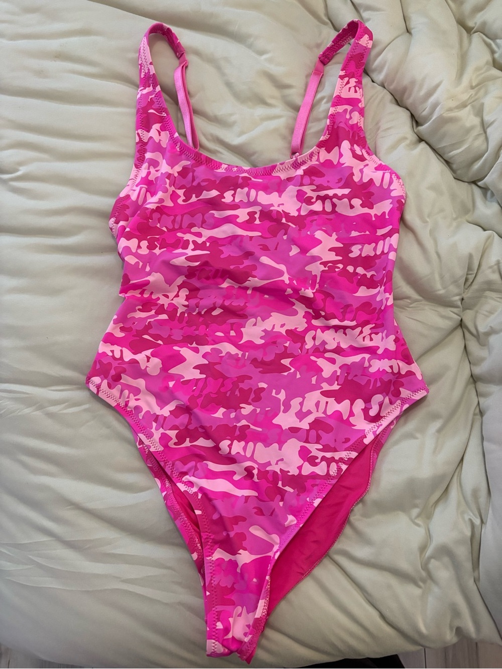 Women’s SKIMS pink camoflauge one piece bathing suit, size medium great conditio